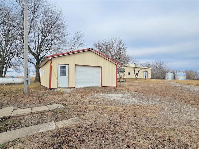 detached garage featuring driveway