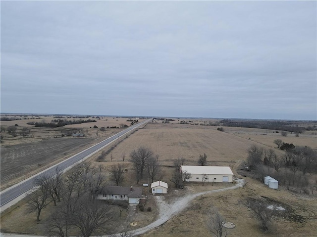 birds eye view of property featuring a rural view