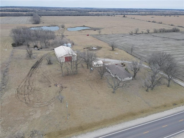 birds eye view of property featuring a rural view