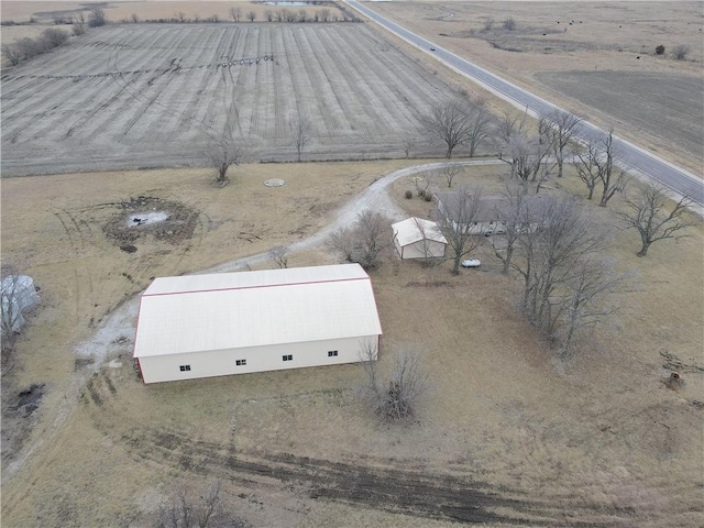 birds eye view of property with a rural view