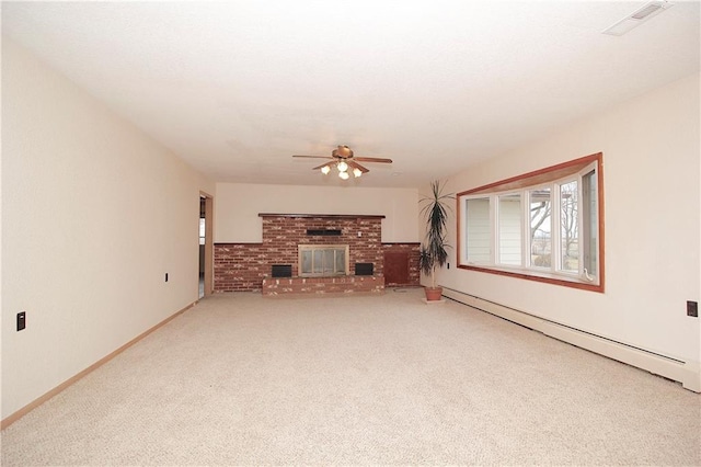 unfurnished living room with ceiling fan, a baseboard radiator, a fireplace, visible vents, and carpet