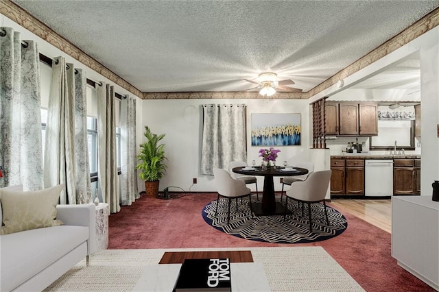 dining area with a textured ceiling and light colored carpet