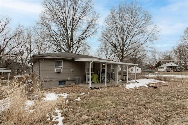 rear view of property featuring a patio and central AC unit