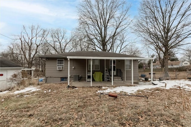 back of house with fence