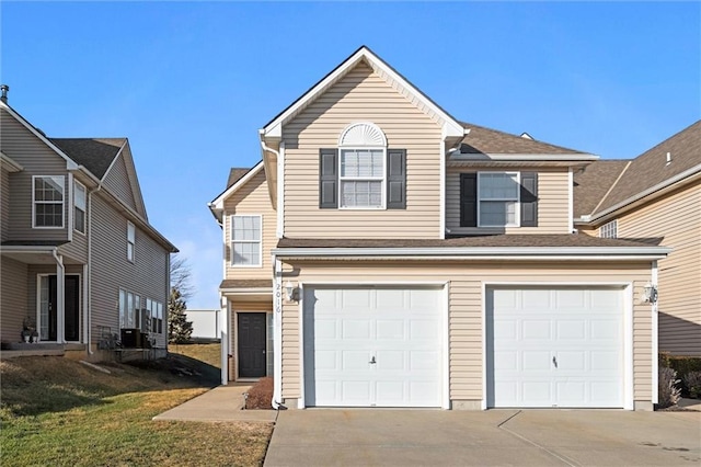 front of property featuring a garage and a front yard