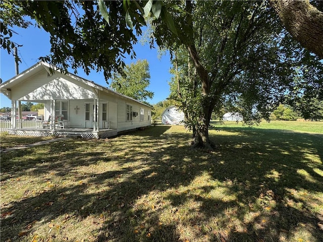 view of yard with covered porch