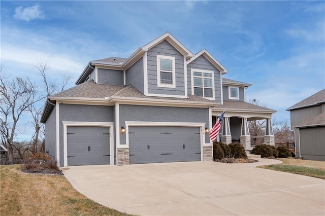 craftsman-style house with concrete driveway, a shingled roof, stone siding, and stucco siding