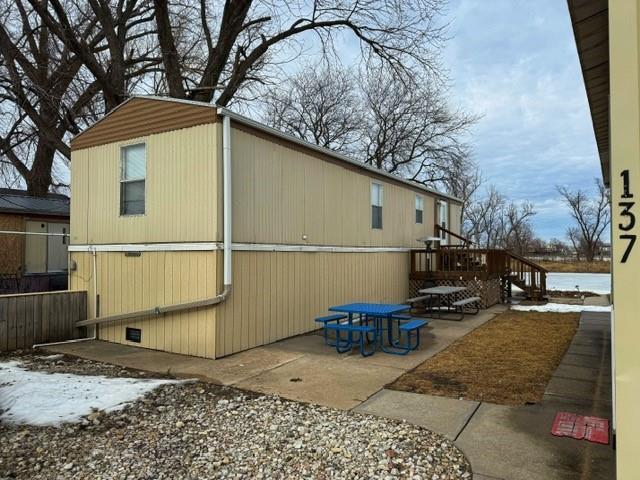 137 Halls Dr, Craig, MO 64437 - view of home's exterior featuring a deck and a patio