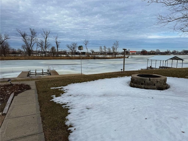137 Halls Dr, Craig, MO 64437 - yard layered in snow featuring an outdoor fire pit