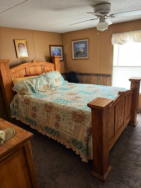137 Halls Dr, Craig, MO 64437 - carpeted bedroom with ceiling fan and a textured ceiling