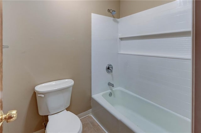 bathroom with tile patterned floors, shower / washtub combination, and toilet