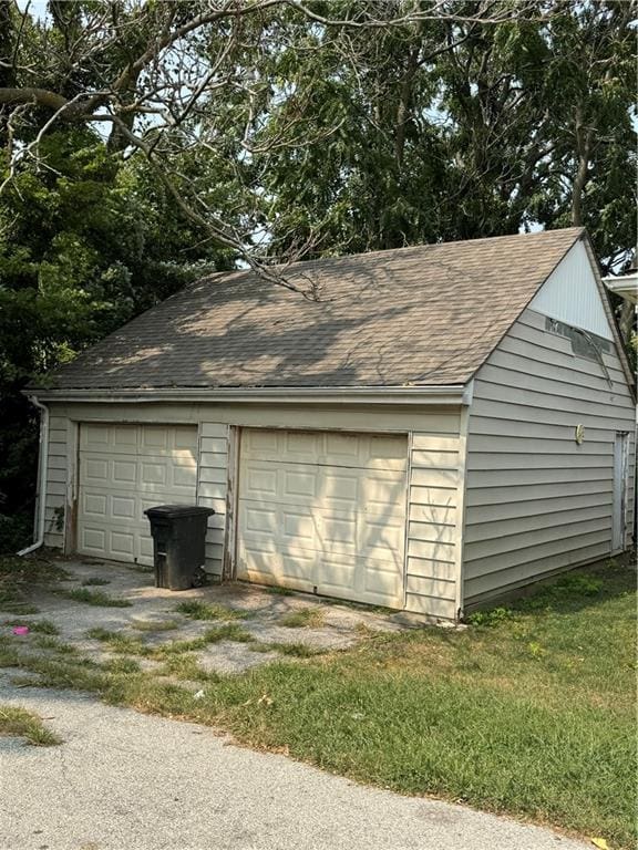 garage with a lawn