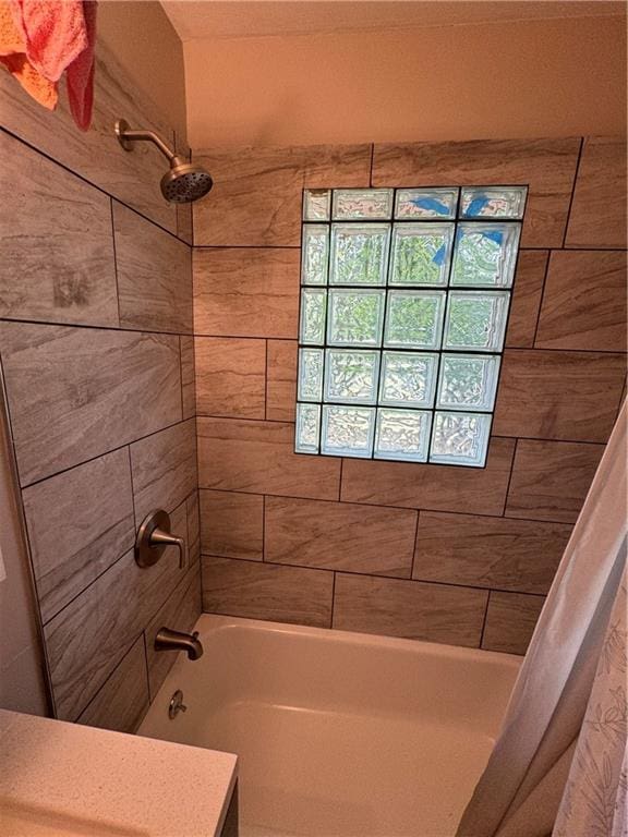 bathroom featuring shower / tub combo with curtain