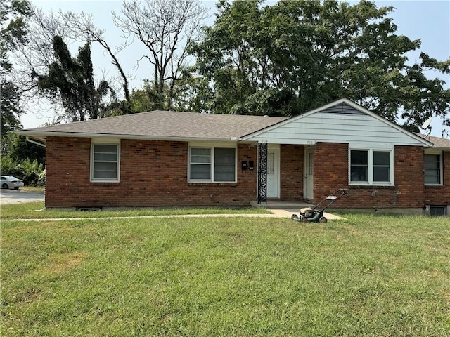 704-706 N Pearl St, Independence, MO 64050 - single story home featuring brick siding and a front lawn