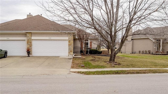 ranch-style house featuring a garage and a front yard