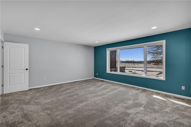 unfurnished room featuring carpet floors, recessed lighting, and baseboards