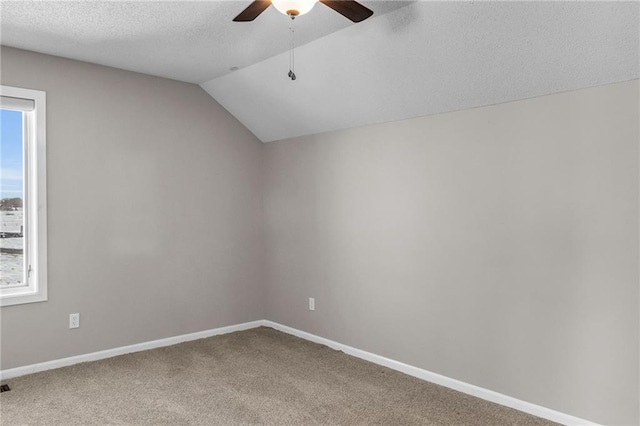 bonus room featuring carpet, vaulted ceiling, and baseboards