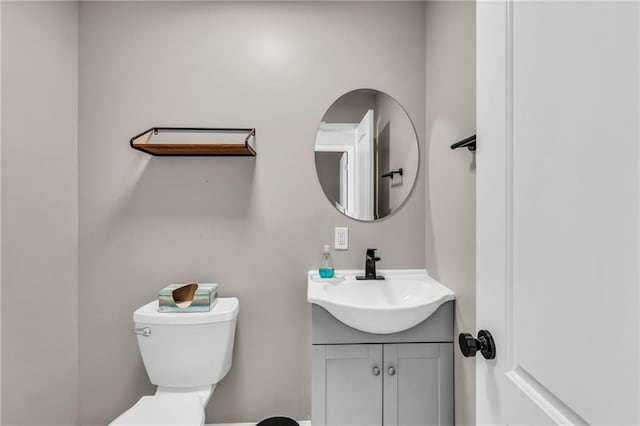 half bath with toilet and vanity