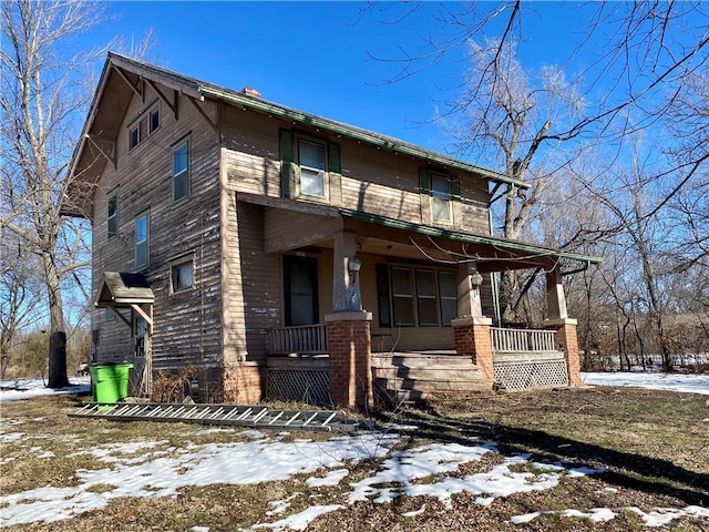 view of front of property featuring covered porch