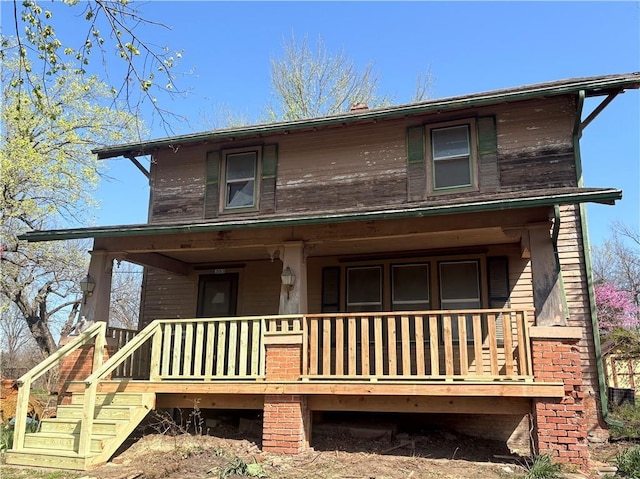 305 E 8th St, Wellsville, KS 66092 - view of front facade featuring a porch