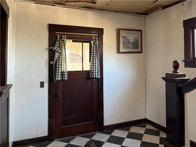 305 E 8th St, Wellsville, KS 66092 - interior space with tile patterned floors, wood walls, and baseboards