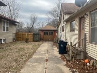 view of home's exterior featuring a storage shed