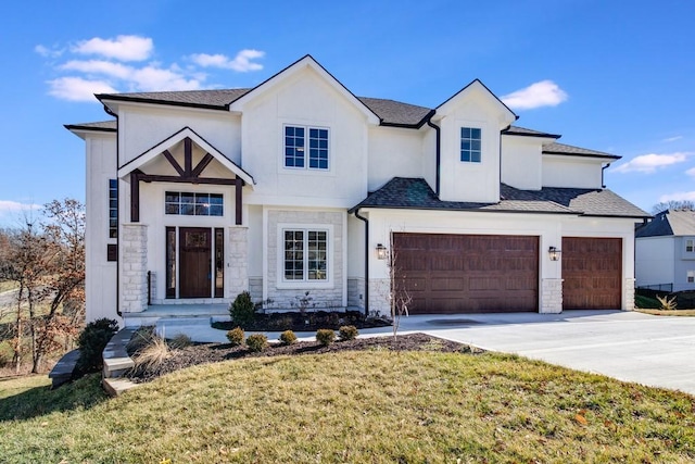 view of front of home featuring a garage and a front lawn