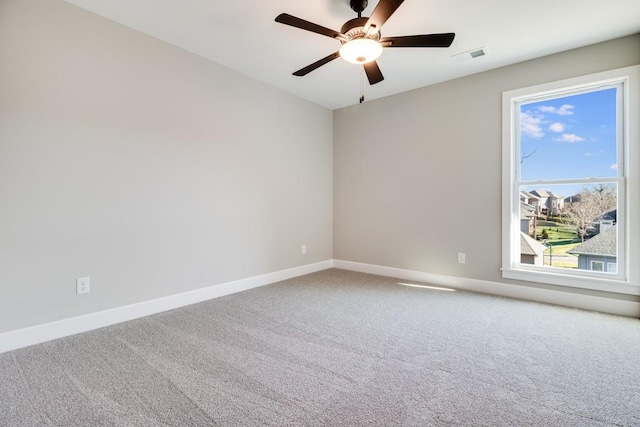 carpeted empty room featuring ceiling fan