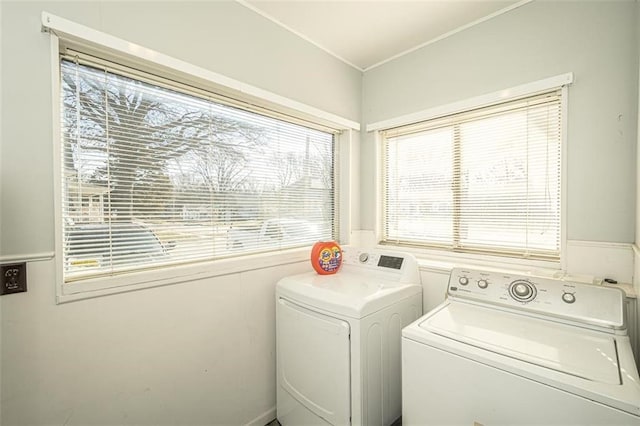 washroom featuring separate washer and dryer and a wealth of natural light