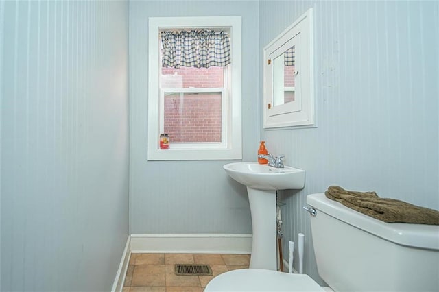 bathroom with tile patterned floors and toilet