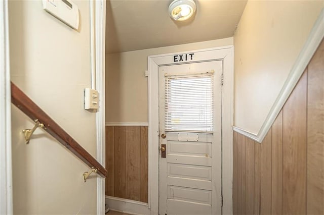 doorway with wooden walls