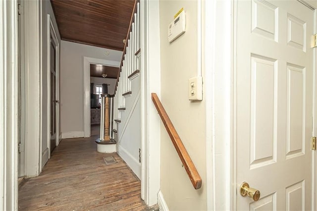 hallway featuring wood ceiling and wood-type flooring