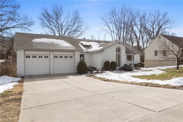 ranch-style house featuring a garage