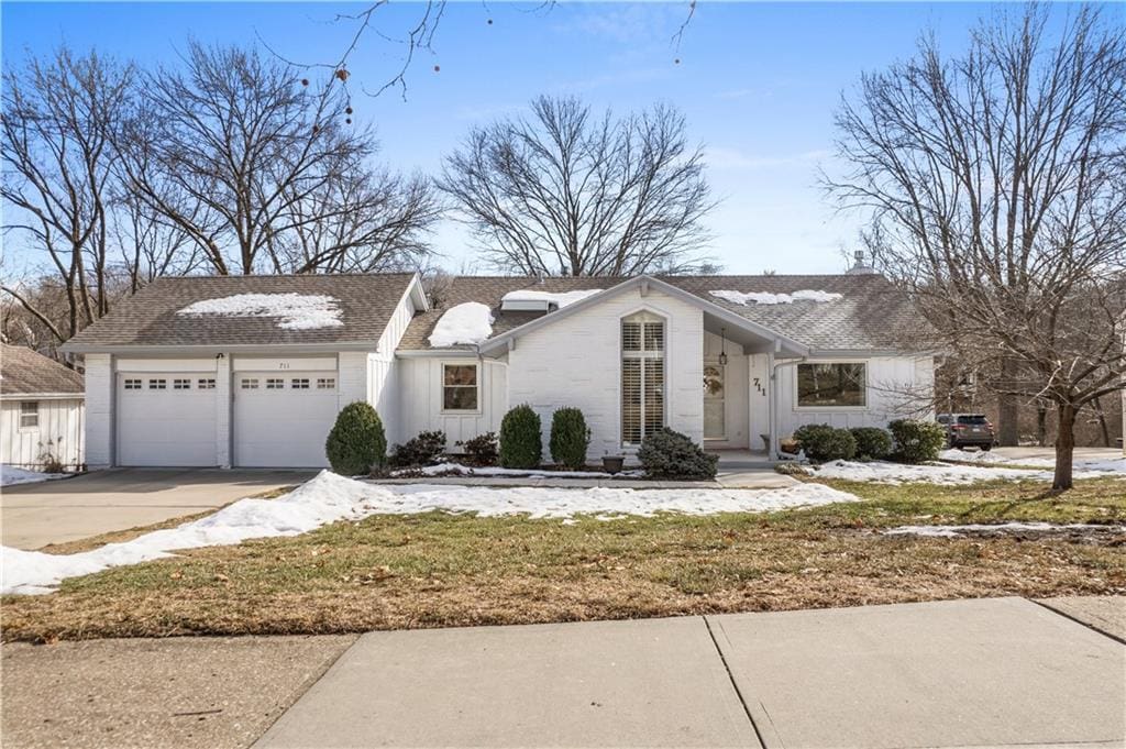 ranch-style home featuring a garage