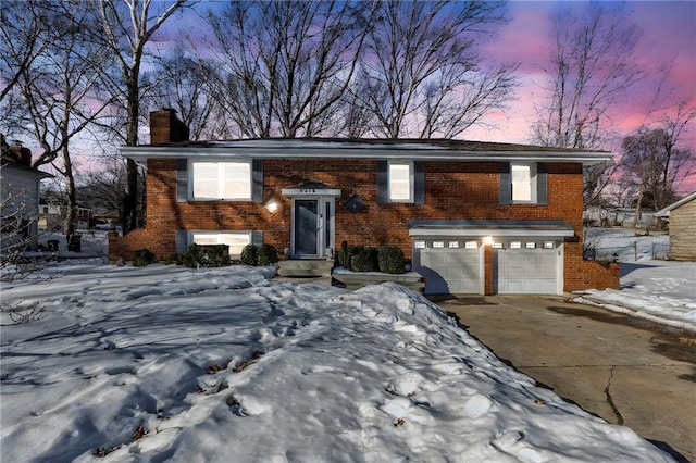 bi-level home featuring a garage