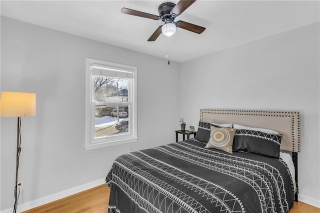 bedroom featuring ceiling fan and wood-type flooring