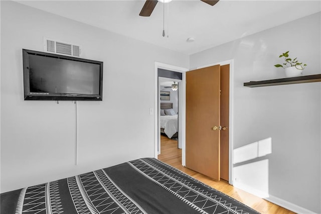 unfurnished bedroom with wood-type flooring and ceiling fan