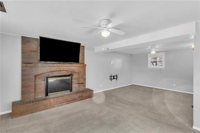 unfurnished living room featuring ceiling fan, a fireplace, and carpet flooring