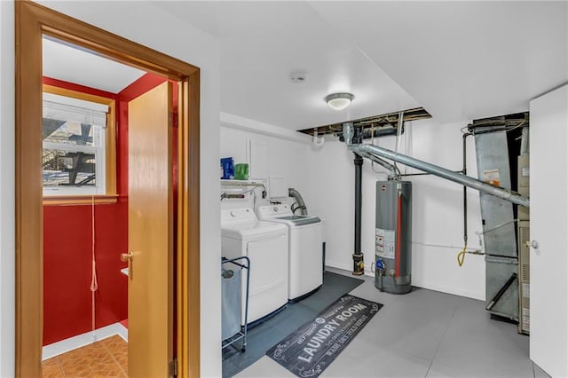 laundry room featuring separate washer and dryer, gas water heater, and heating unit