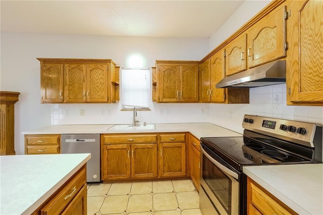 kitchen featuring tasteful backsplash, sink, and appliances with stainless steel finishes