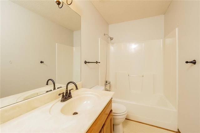 full bathroom featuring vanity, bathing tub / shower combination, and toilet