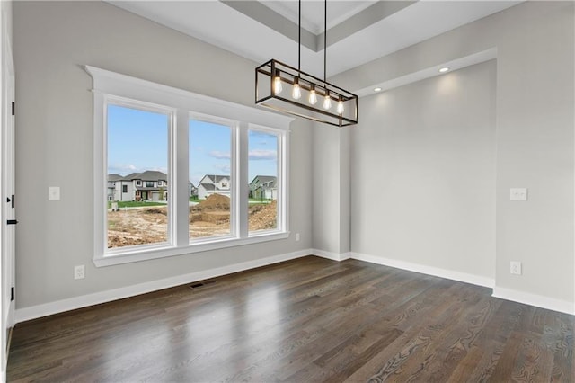 unfurnished dining area featuring dark hardwood / wood-style floors