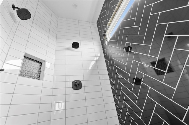 bathroom with tiled shower