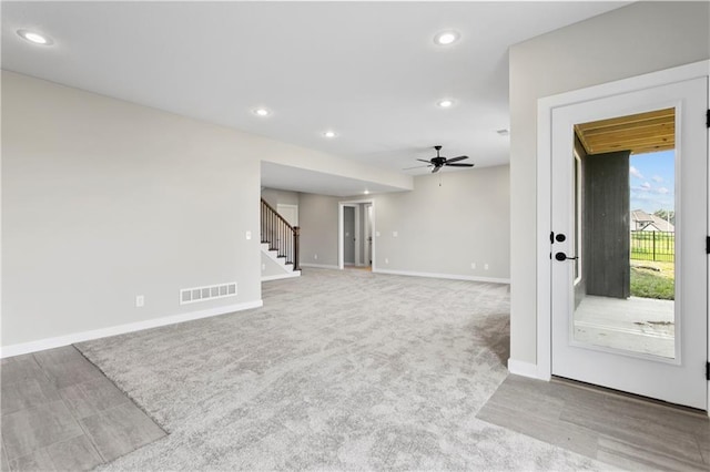 living room featuring ceiling fan and carpet flooring