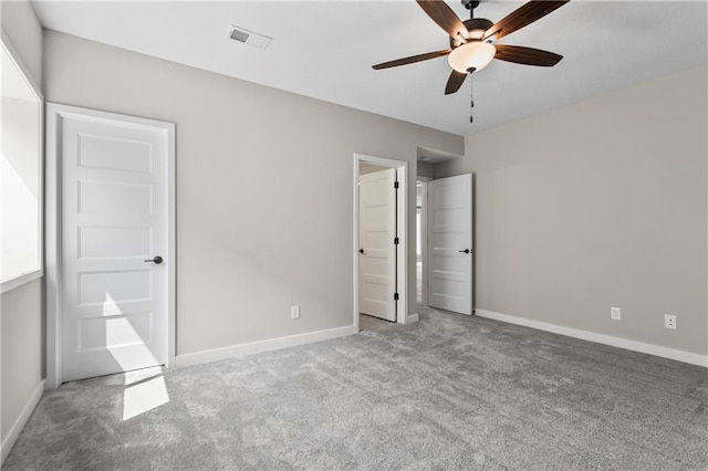 unfurnished bedroom featuring ceiling fan and light colored carpet