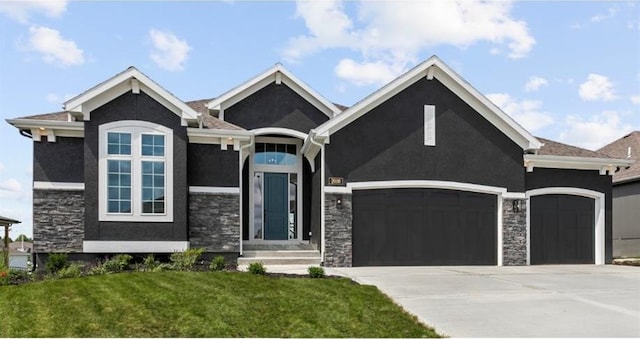 view of front of house with a garage and a front yard