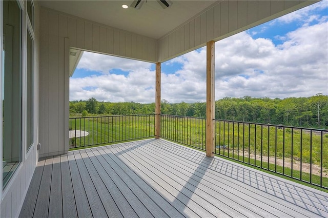 9000 N Clarion Ave, Kansas City, MO 64153 - wooden deck with ceiling fan and a wooded view