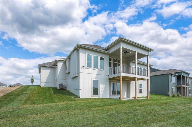 9000 N Clarion Ave, Kansas City, MO 64153 - rear view of house featuring ceiling fan, cooling unit, a balcony, and a yard