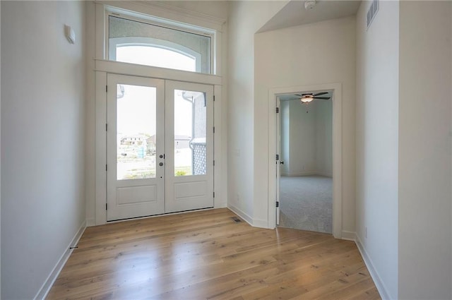 9000 N Clarion Ave, Kansas City, MO 64153 - entrance foyer featuring french doors, light wood-style flooring, baseboards, and a ceiling fan