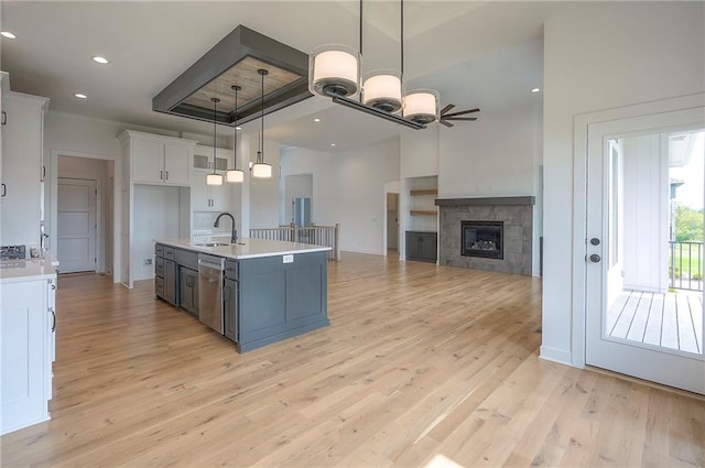 9000 N Clarion Ave, Kansas City, MO 64153 - kitchen featuring a sink, white cabinetry, light countertops, dishwasher, and recessed lighting